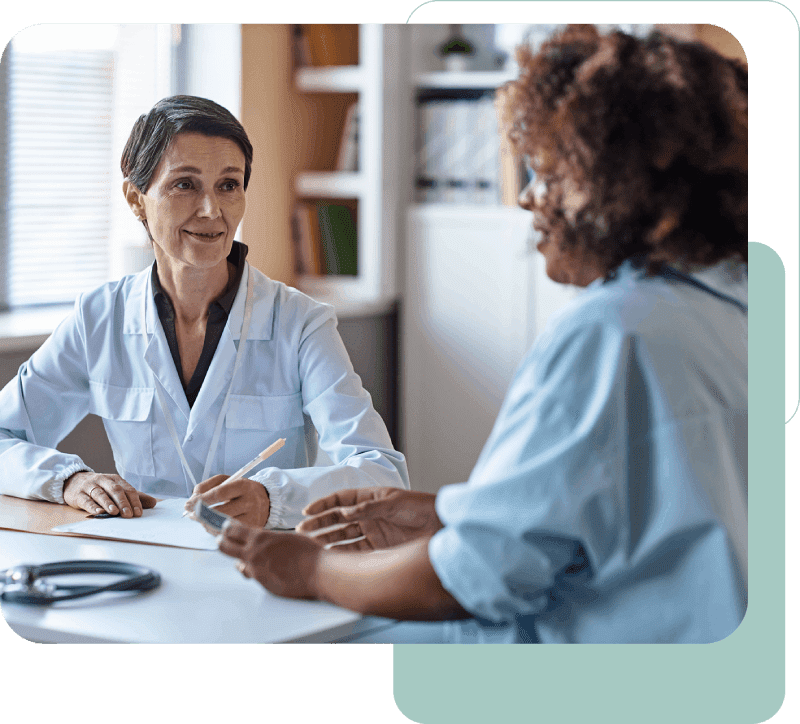 Doctor consulting with patient in office setting.